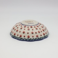 Boleslawiec ceramic bowl on table – traditional Polish pottery for everyday use.