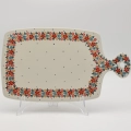 This impressive, hand-decorated ceramic board is the perfect blend of function and art, ideal for elegantly serving large platters of cold cuts, cheeses, or bread. Made from durable Bolesławiec stoneware.